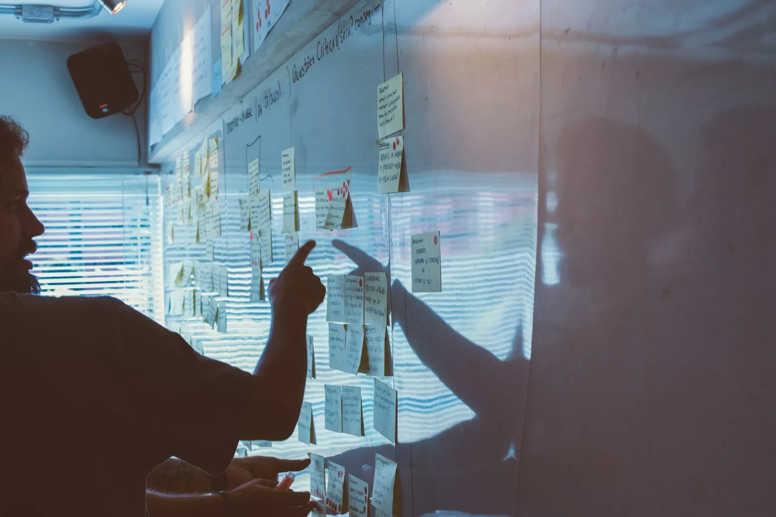 Team mapping strategy with sticky notes on a planning wall